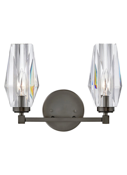 A modern outdoor wall light with a black finish and clear seeded glass featuring a rectangular design.