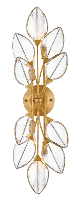A modern ceiling fan with three dark wood-tone blades and a central light kit.