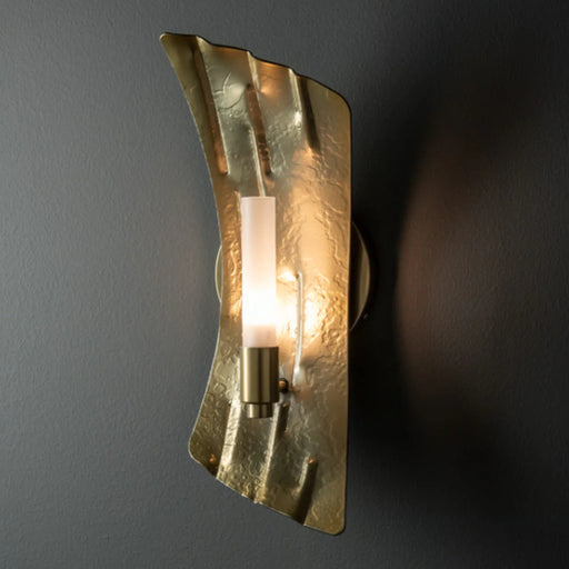 A modern ceiling fan with four broad light wood-tone blades and an integrated circular light.