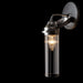 A modern ceiling fan with light wood-tone blades and a circular light kit.