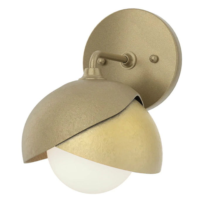 An angled view of a modern ceiling fan with a dark bronze finish and an integrated light.
