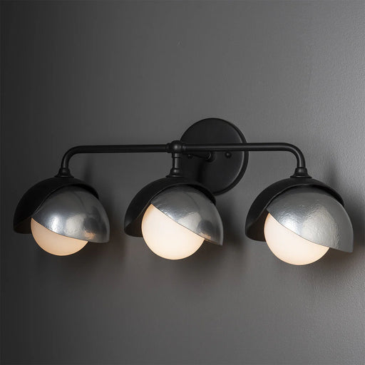 A close-up of a modern semi-flush mount ceiling fan.