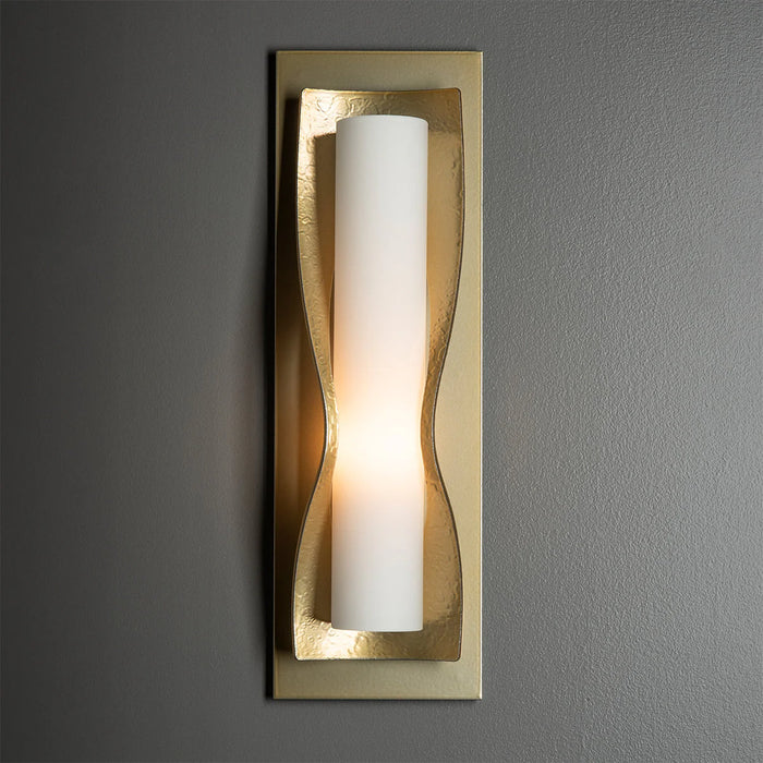 An angled view of a modern ceiling fan with silver blades and an integrated light.
