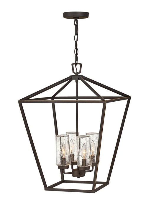 A traditional outdoor wall lantern with an oil-rubbed bronze finish and clear seeded glass.