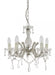 Modern black and brass four-light linear pendant with spherical clear glass shades, angled view.