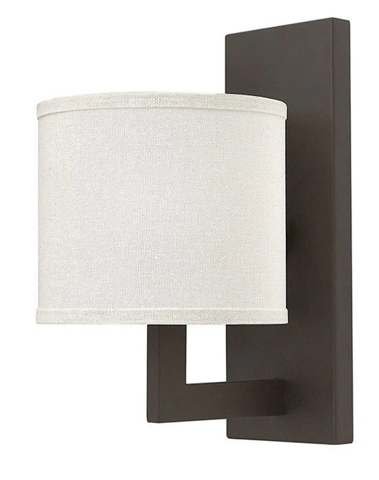 Bronze traditional outdoor wall light with a rectangular shape and clear glass panels, side view.