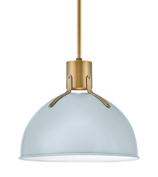 Polished brass outdoor wall lantern with clear seeded glass panels, cropped view.