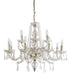 Modern black and brass 12-light linear chandelier with clear cylindrical shades.