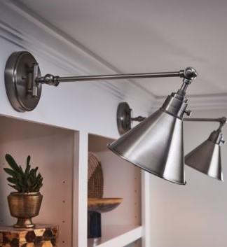 Polished chrome cylindrical pendant light in an application setting.