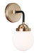 A modern outdoor wall light with a cage-like design and a dark bronze finish casting light upwards and downwards.