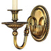 A large traditional bronze chandelier with two tiers of candle-style lights.
