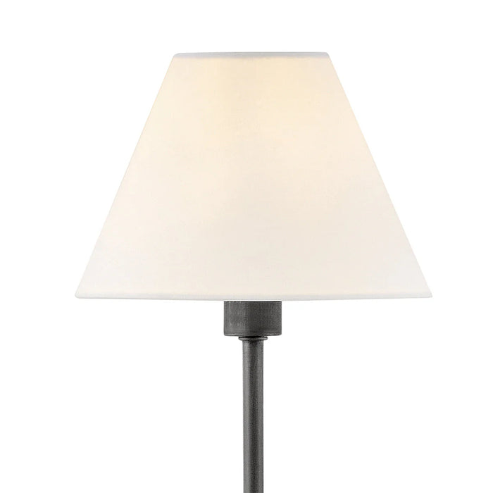 A side view of a small black modern wall light with a frosted glass panel.