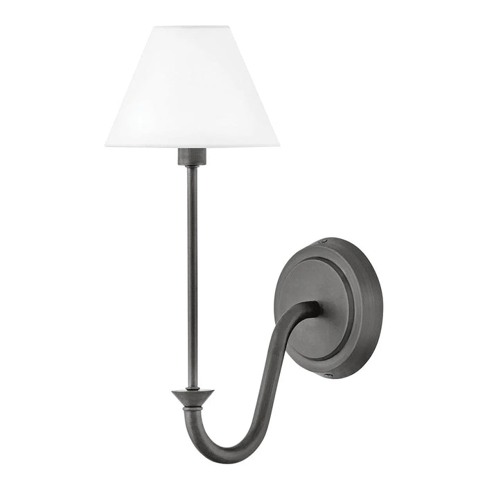 An angled view of a small black modern wall light with a frosted glass diffuser.