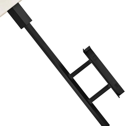 A close-up of a black outdoor wall light with seeded glass.