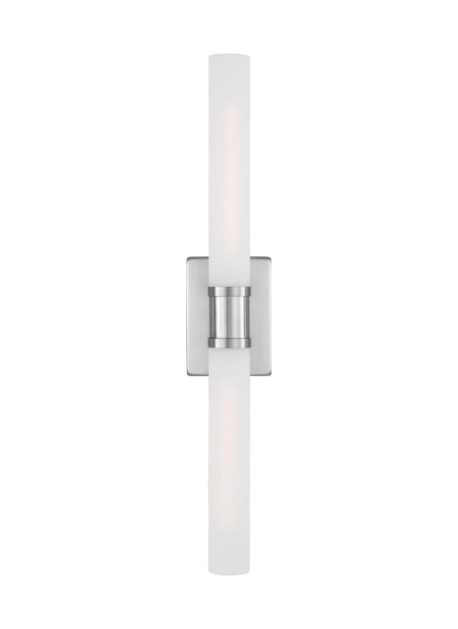 A tall slender white floor lamp with a drum shade and a circular base.