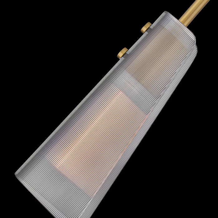 An angled view of a modern light wood-tone ceiling fan with a sleek design.