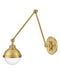 A contemporary linear pendant light with multiple clear glass shades and a satin brass finish.
