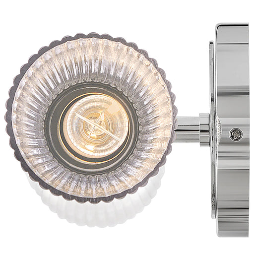 A polished nickel flush mount ceiling light with a white glass bowl detailed view.