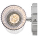 A polished nickel flush mount ceiling light with a white glass bowl detailed view.