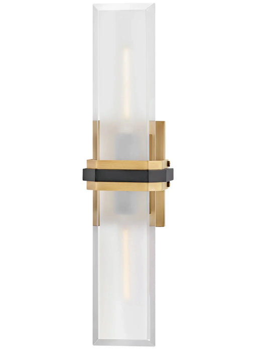 A contemporary wall sconce with a white cylindrical glass shade and a matte black finish base.