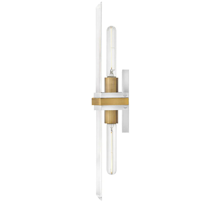 A modern polished nickel wall sconce with a white cylindrical glass shadeviewed from a slightly different angle.