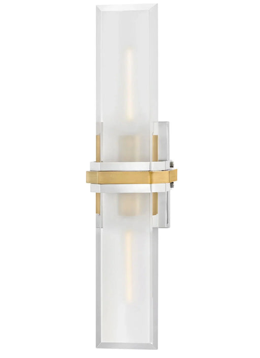 A sleek modern wall sconce with a cylindrical white glass shade and a polished nickel base.