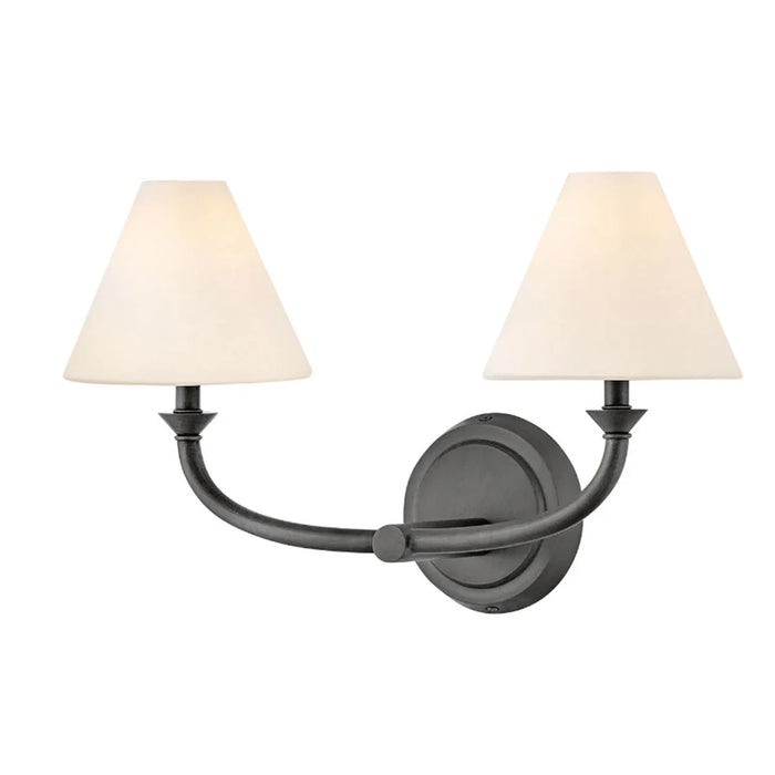 An angled view of a black open-cage wall light.