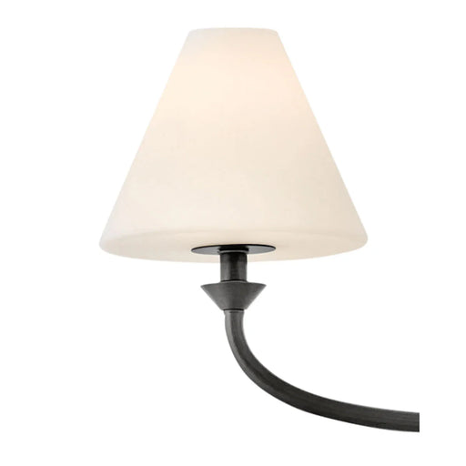 A close-up of a modern wall light showcasing its open black frame.
