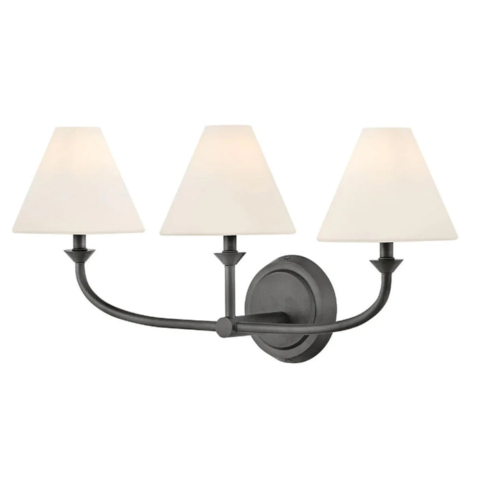 An angled view of a black open-cage wall light.