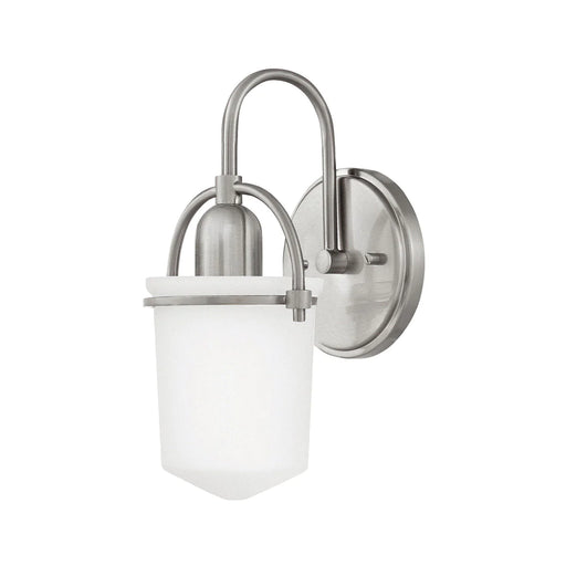 Brushed nickel flush mount ceiling light with a spherical glass shade.