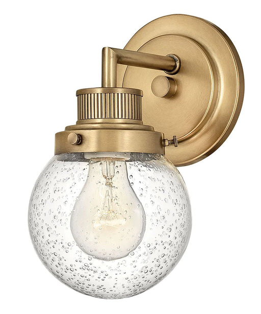 Heritage bronze modern chandelier with multiple arms and spherical glass shades.