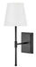A traditional outdoor wall light with a black finish and clear seeded glass panels.