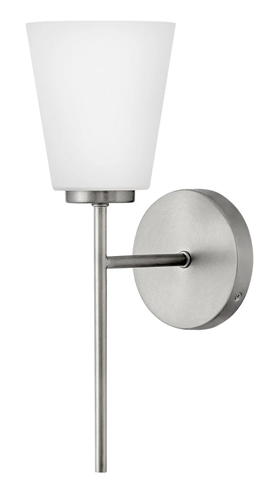 A modern bronze outdoor wall lantern with clear glass panels.