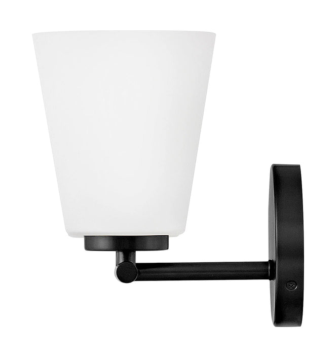 An angled view of a modern black outdoor wall lantern.