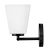 An angled view of a modern black outdoor wall lantern.