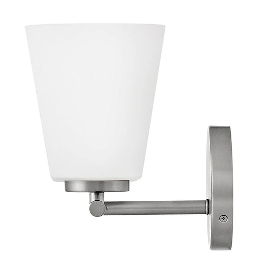 An angled view of a modern bronze outdoor wall lantern.