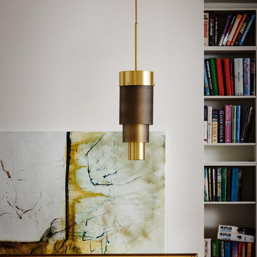 Large, modern wall sconce with a rectangular, metallic frame and a central light bar.