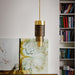 Large, modern wall sconce with a rectangular, metallic frame and a central light bar.