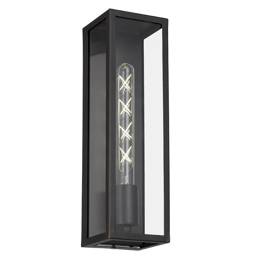 A modern outdoor wall light with a black finish and a clear cylindrical glass shade.