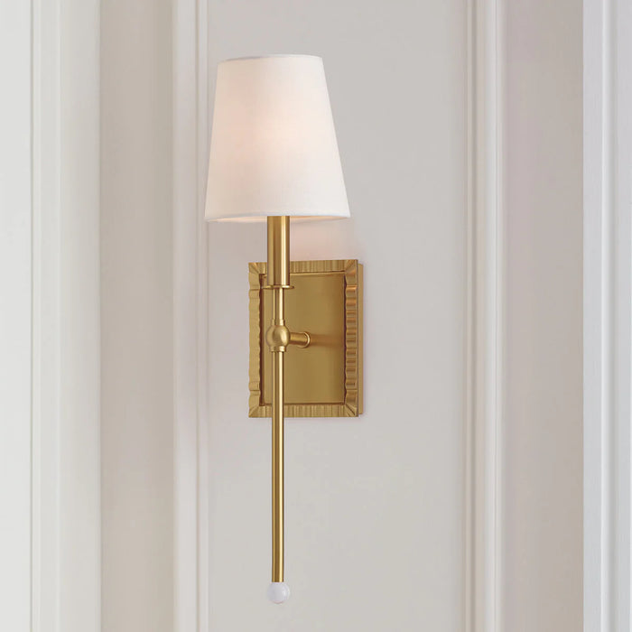 An angled view of a modern brushed steel flush mount light.