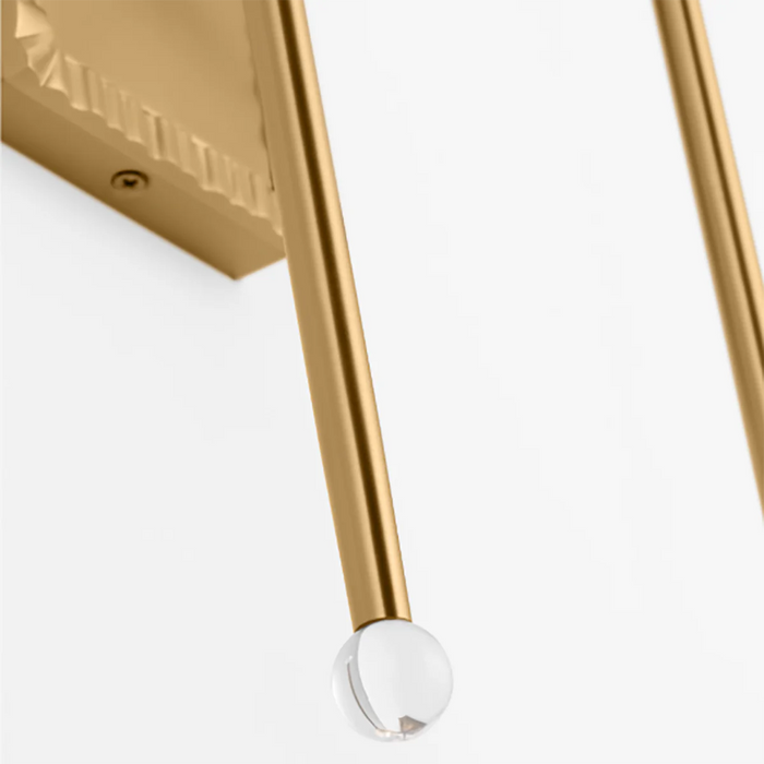 An angled view of a modern brushed steel flush mount light.