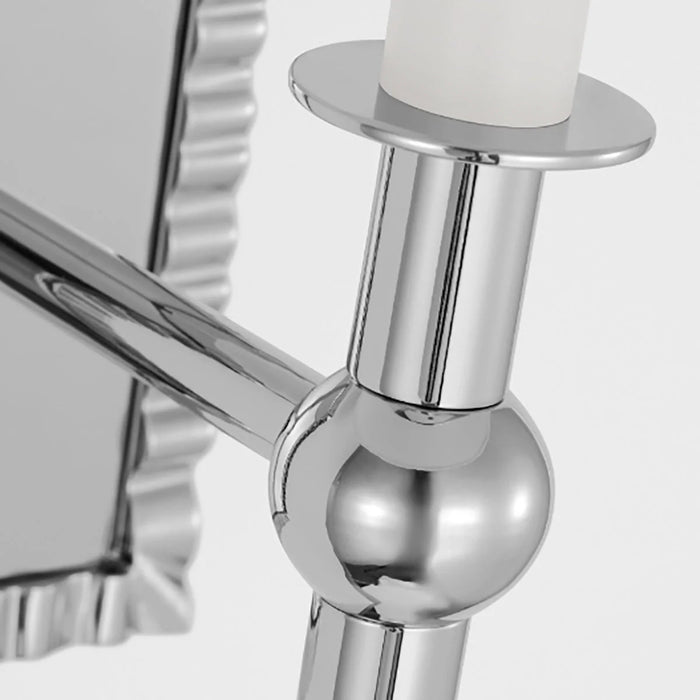 A close-up of a modern polished nickel circular flush mount light.