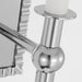 A close-up of a modern polished nickel circular flush mount light.
