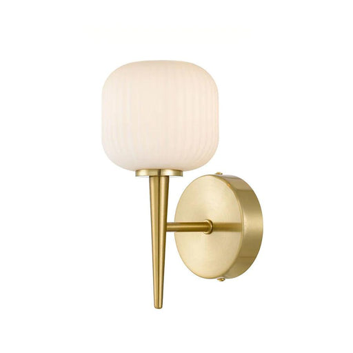Aged gold wall sconce with a spherical opal glass shade and a minimalist design.