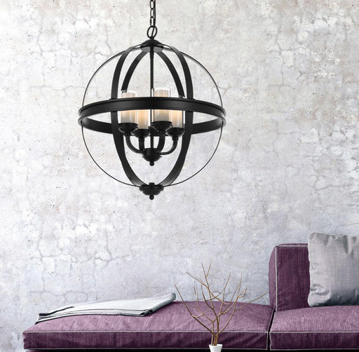 Black four-light linear pendant with cylindrical clear glass shades, illuminated.