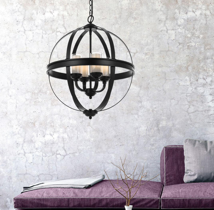 Black four-light linear pendant with cylindrical clear glass shades, illuminated.