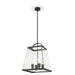Black three-light linear pendant with spherical frosted shades.