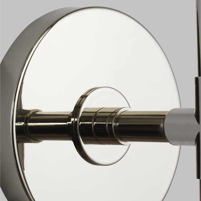A close-up of a modern polished nickel ceiling fan.