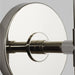A close-up of a modern polished nickel ceiling fan.