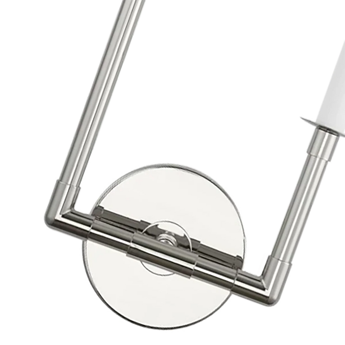 A close-up of a modern polished nickel ceiling fan.